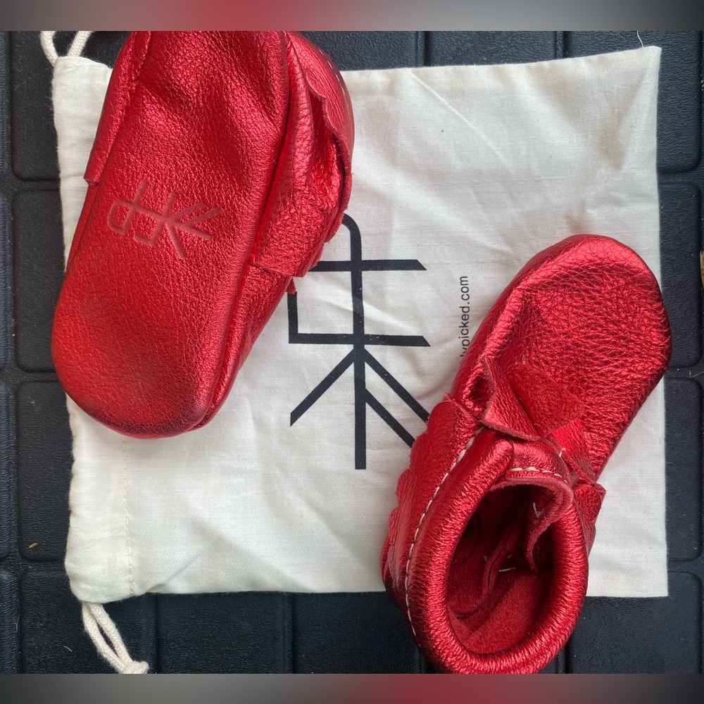 Freshly picked red metallic bow moccasins